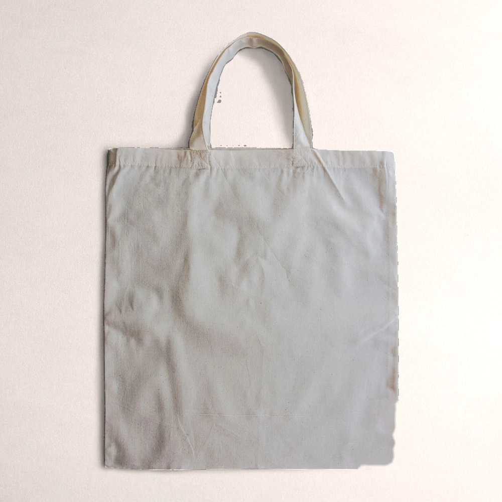 A plain natural canvas tote bag, ready for your logo or artwork